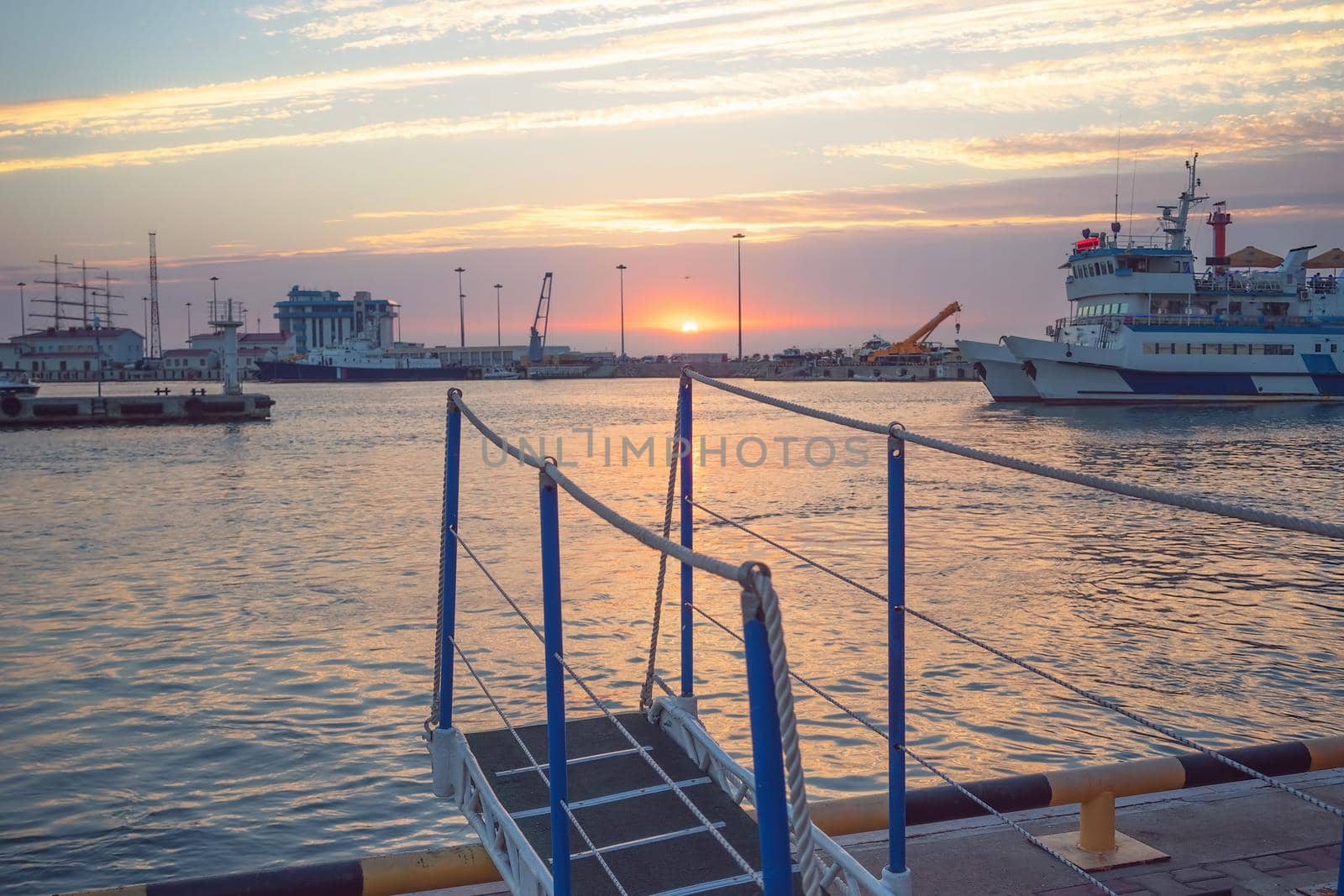 Sochi, Russia. Sea port with sunset view and ships.