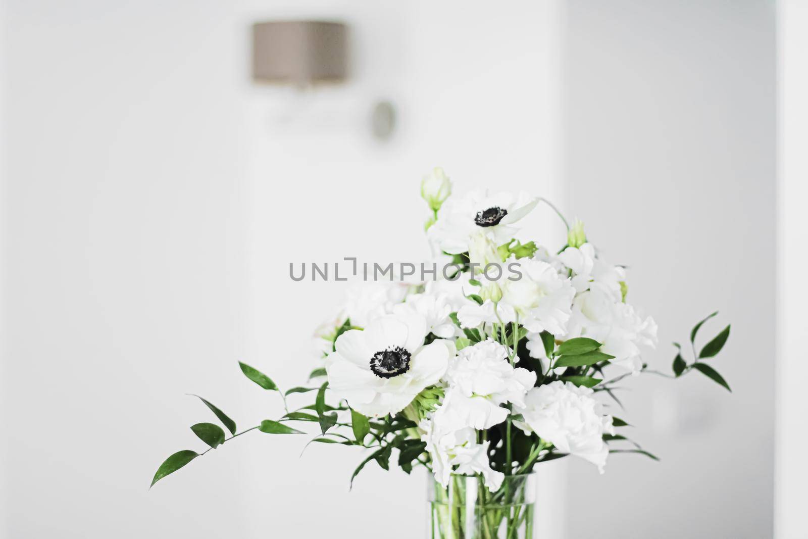 Bouquet of flowers in vase and home decor details, luxury interior design closeup