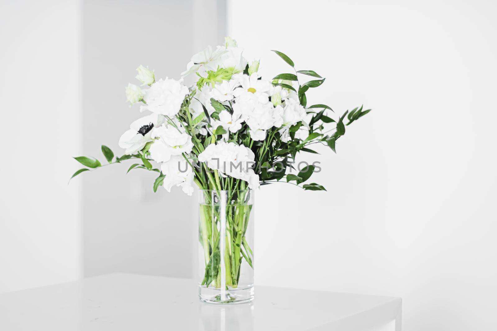 Bouquet of flowers in vase and home decor details, luxury interior design closeup