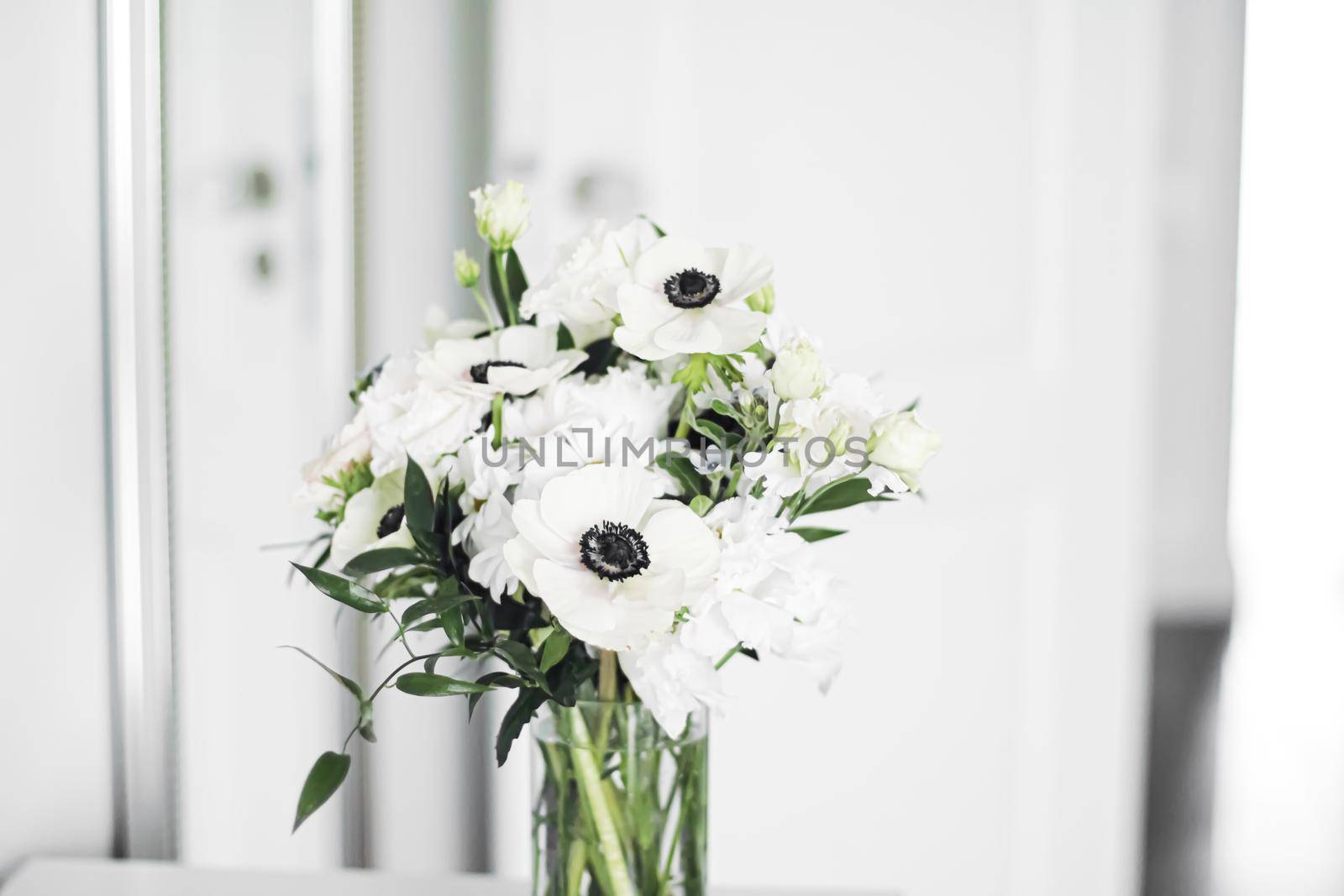 Bouquet of flowers in vase and home decor details, luxury interior design closeup