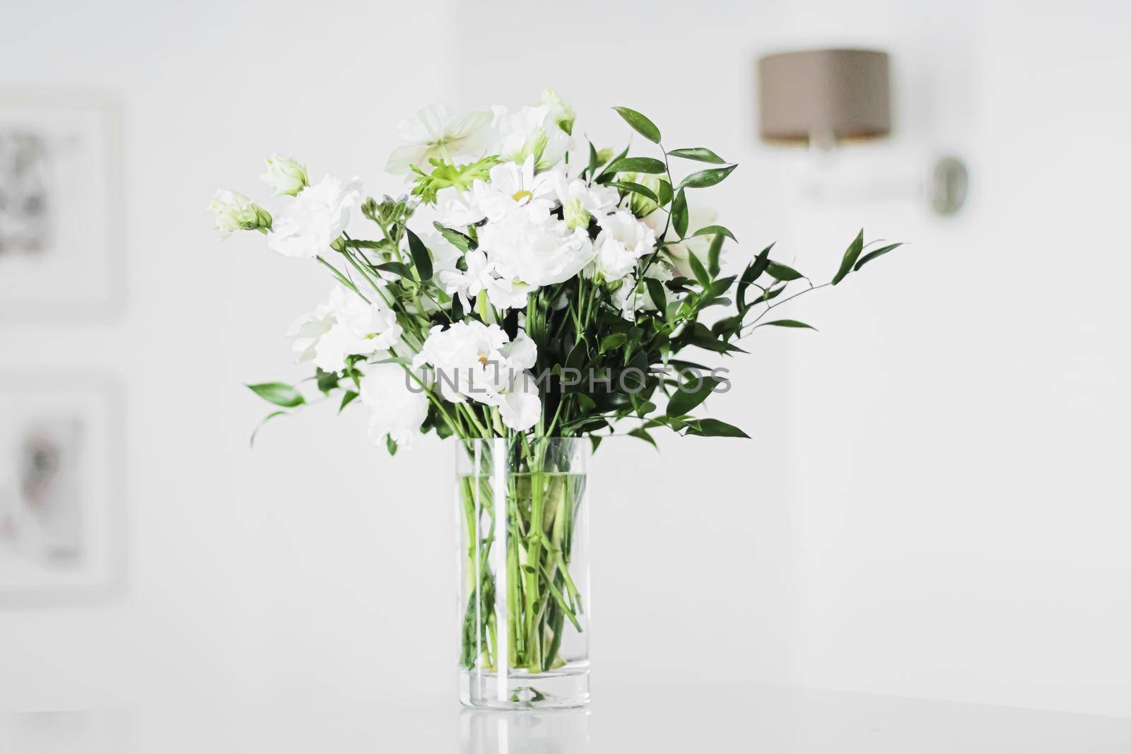 Bouquet of flowers in vase and home decor details, luxury interior design closeup