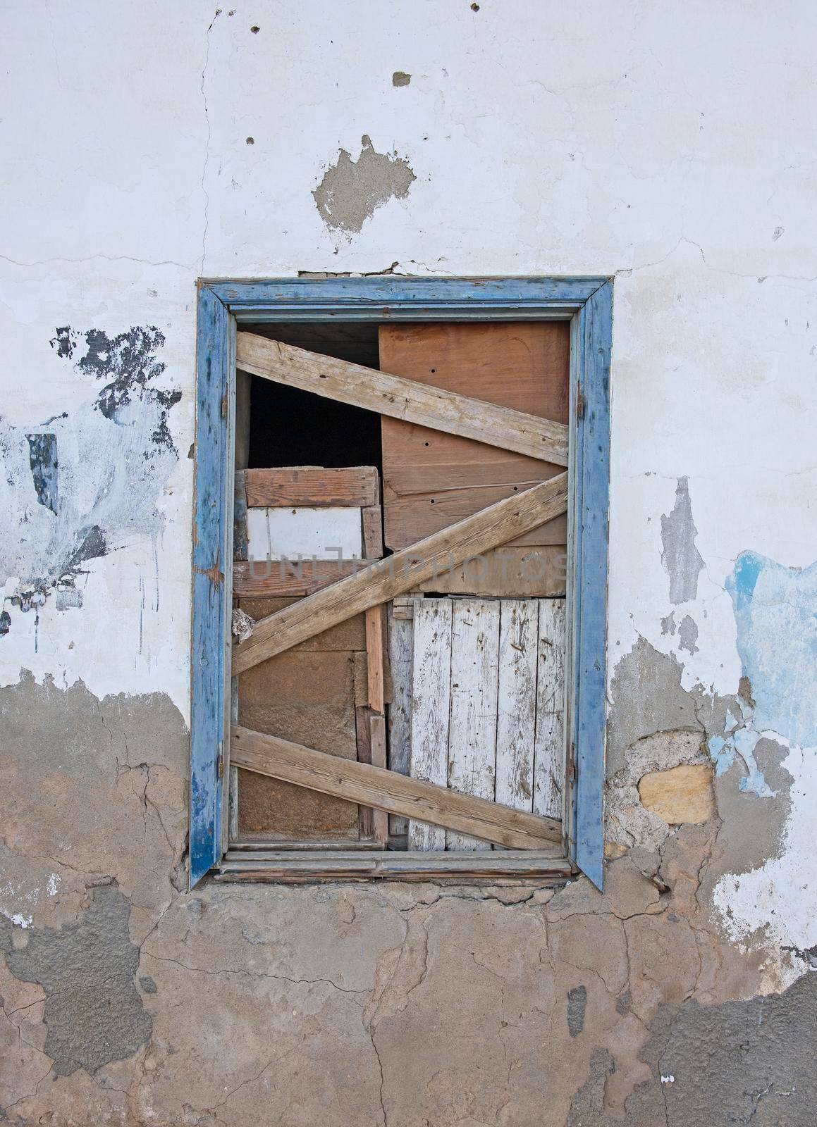 Old wooden boarded up window in abandoned egyptian house by paulvinten