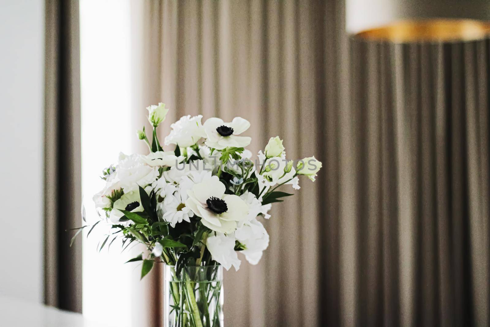 Bouquet of flowers in vase and home decor details, luxury interior design closeup