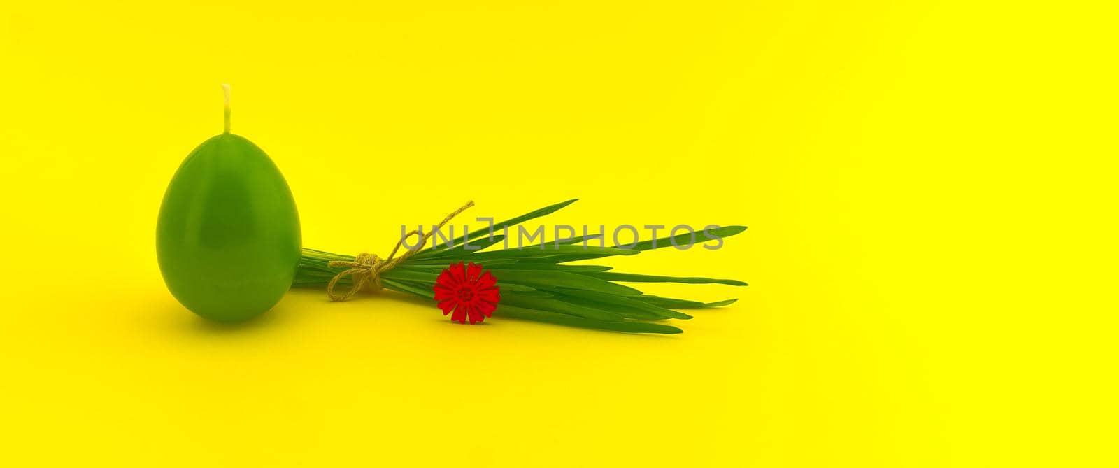 Minimalistic Easter banner with egg shaped candle by NetPix