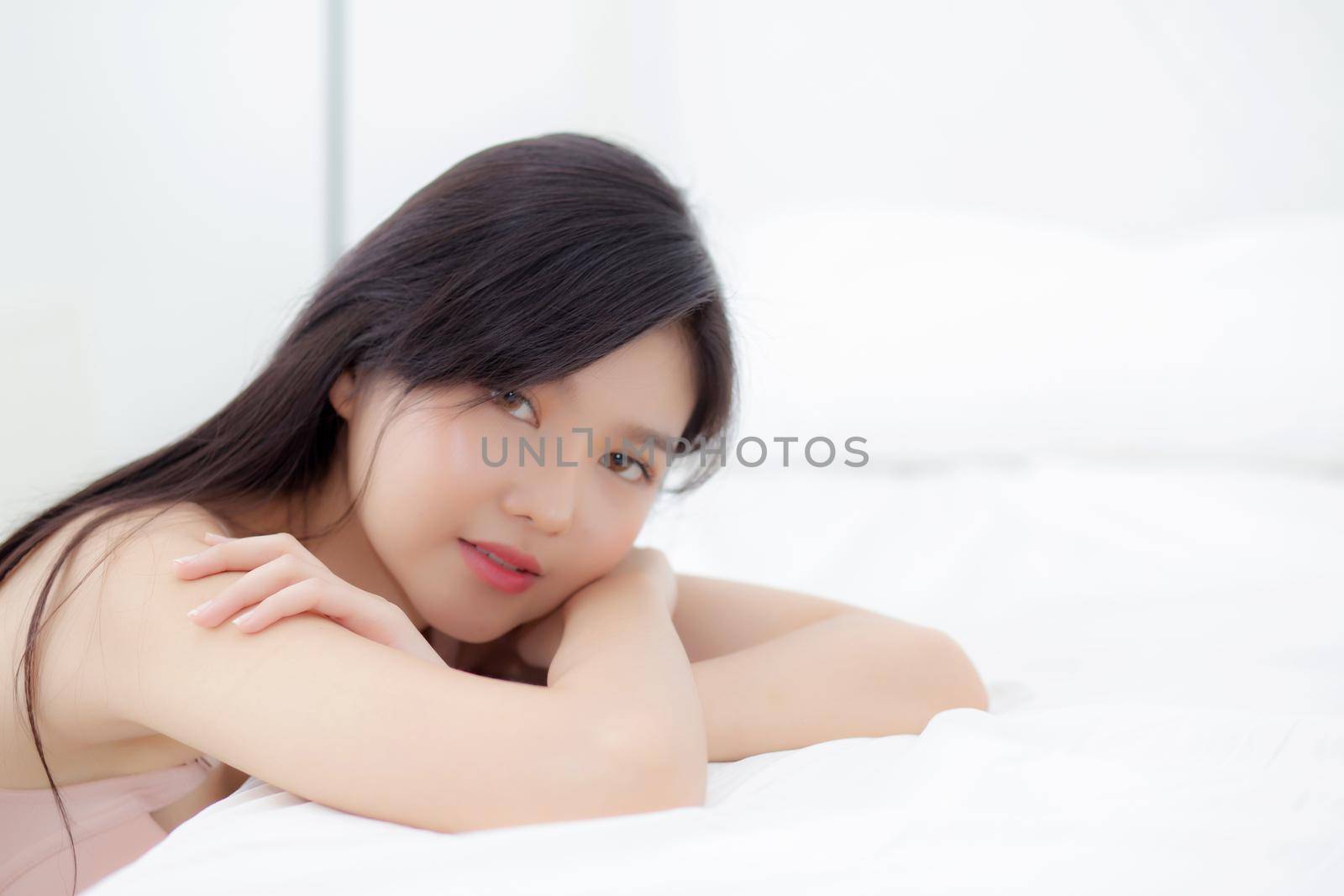 Beautiful portrait young asian woman sexy in underwear figure fit relax with seductive in bedroom, asia girl body slim in lingerie confident and happy lying on bed in bedchamber, lifestyle concept.