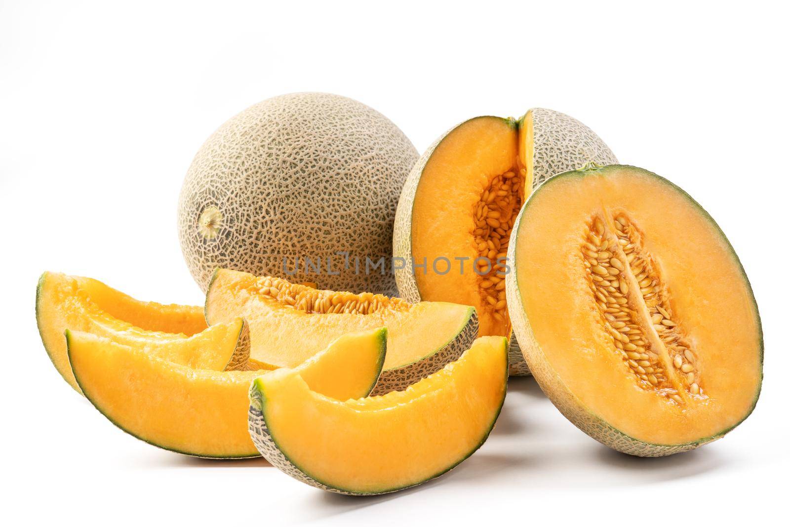 Close up of beautiful tasty sliced juicy cantaloupe melon, muskmelon, rock melon isolated on white background.