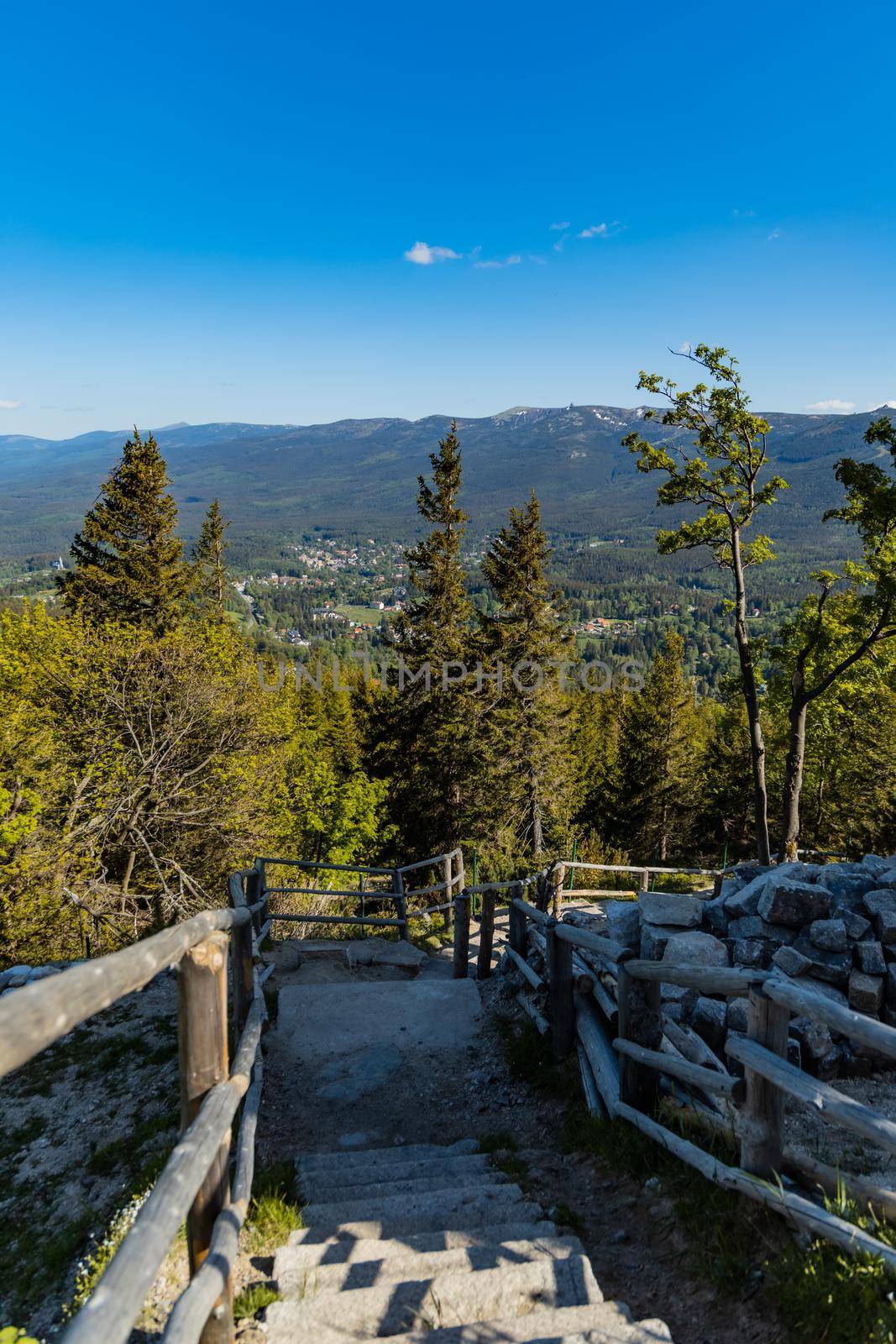 High stony stairs with wooden railings down of mountain by Wierzchu