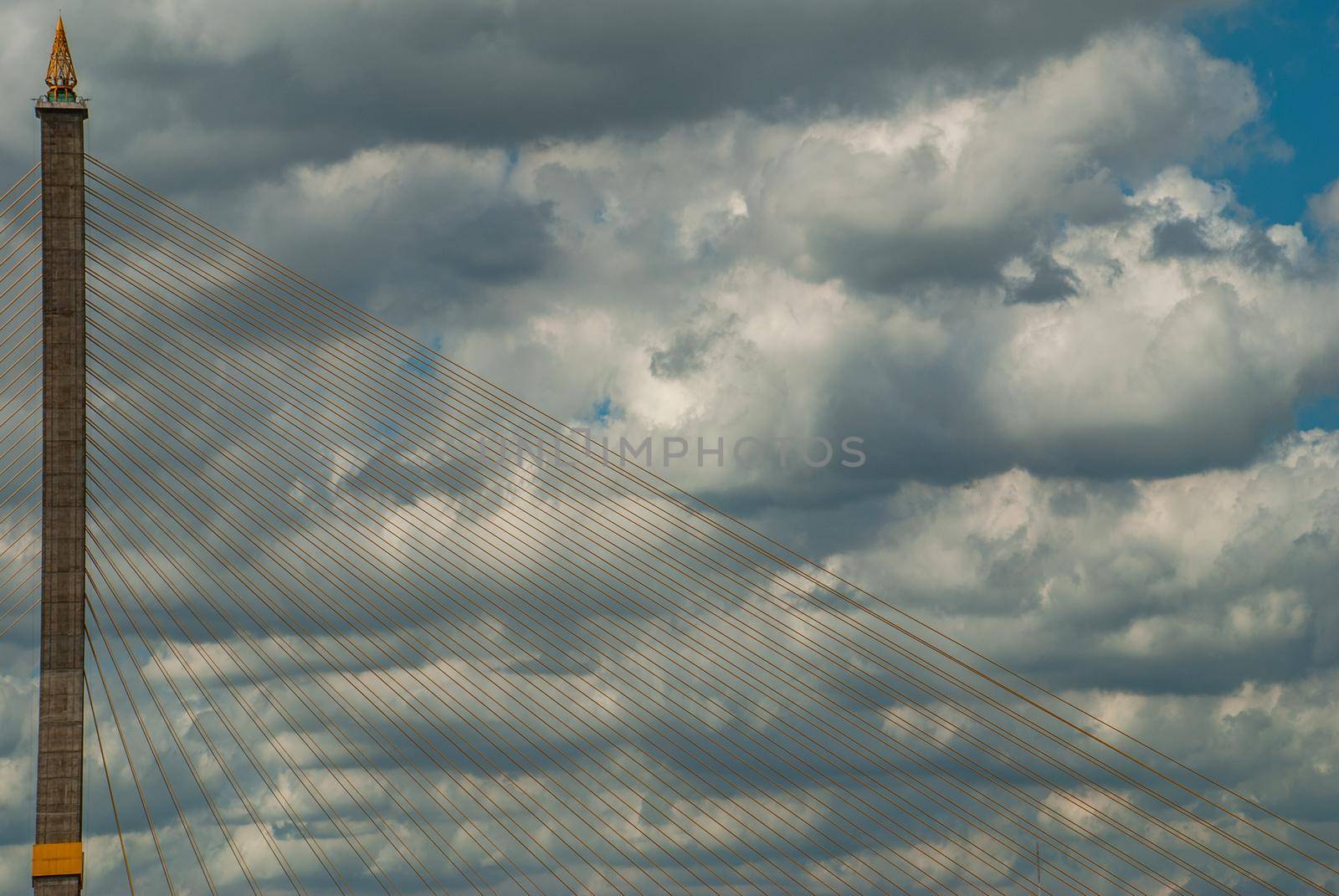 Bangkok, thailand 21 Jul, 2019 : Rama VIII bridge, Rope Bridge across the Chao Phraya River, A tall V-shape pylon tower with view blue sky is background, Cloudy day.