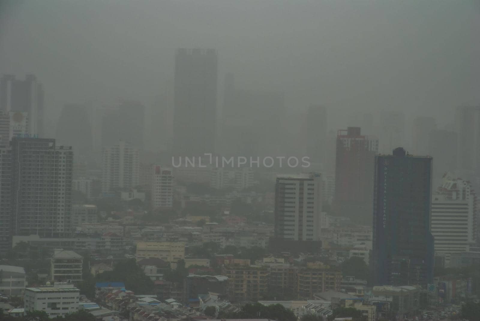 Bangkok, Thailand - 25 Jul, 2019: Morning sky view of Bangkok with skyscrapers in fog, city view, downtown business district concept.