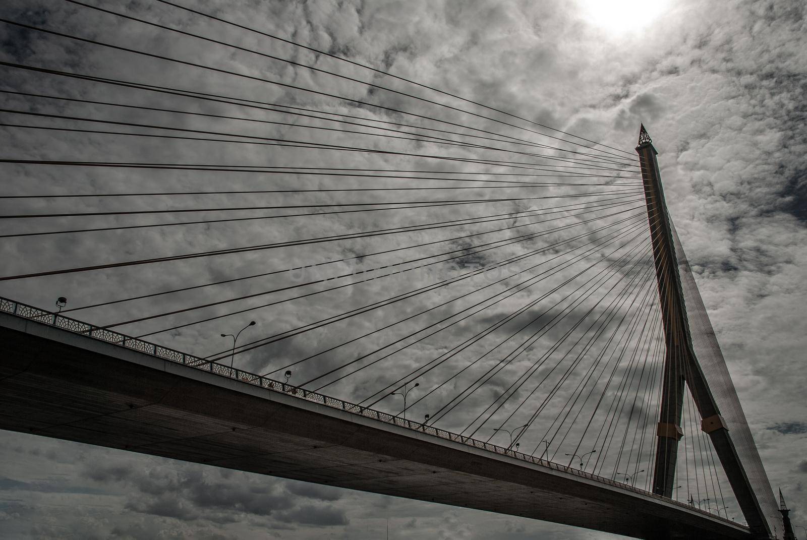 Bangkok, thailand 21 Jul, 2019 : Rama VIII bridge, Rope Bridge across the Chao Phraya River, A tall V-shape pylon tower with view blue sky is background, Cloudy day.