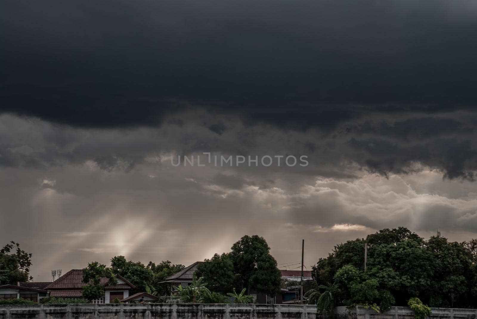 Bangkok, Thailand - 21 Jul 2019 : A view of the Chao Phraya River showing the several wooden local houses in the evening along the Chao Phraya riverside.
