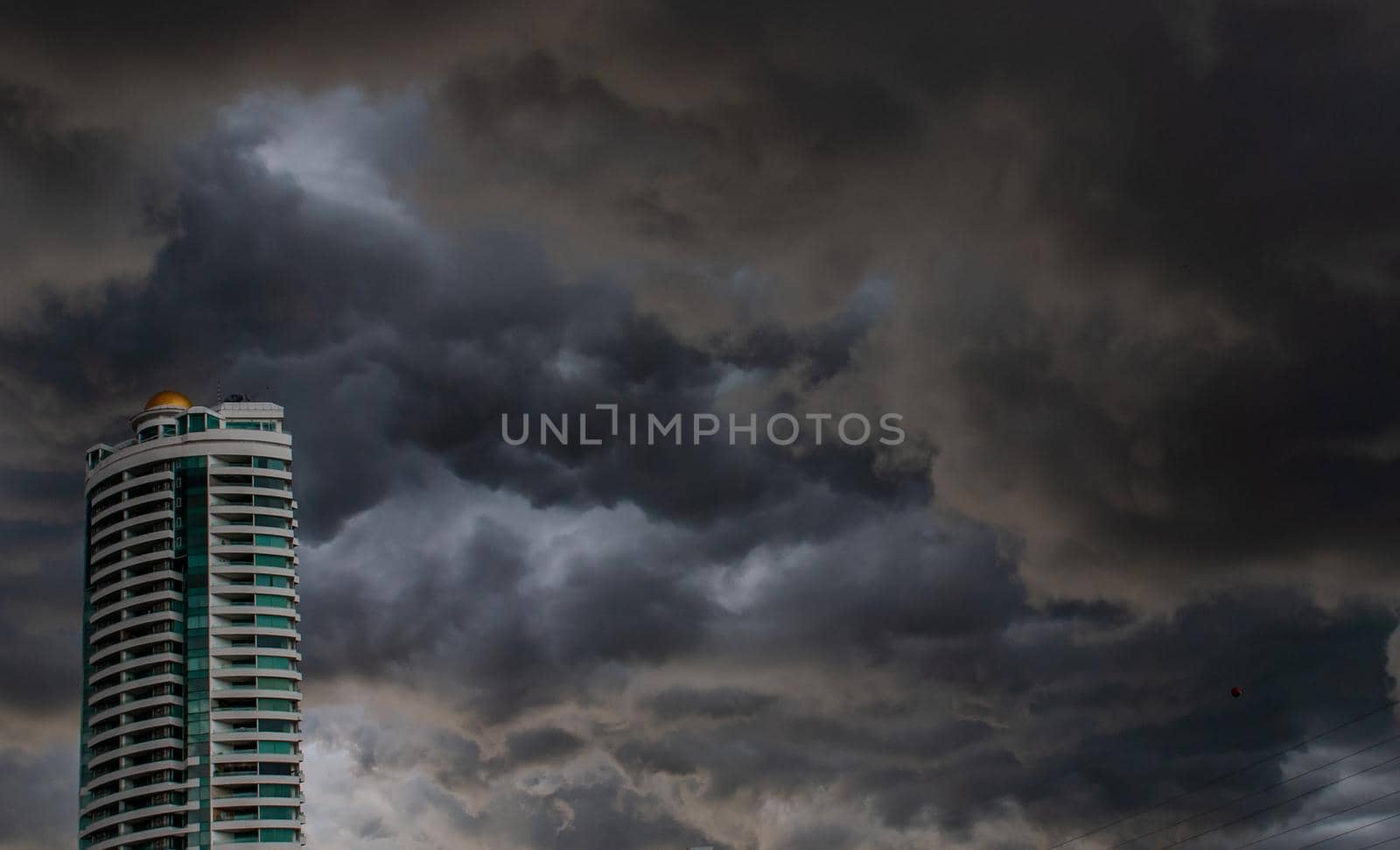 Bangkok, Thailand - 21 Jul 2019 : Beautiful clouds and sky with sun rays over the city, before heavy rain, Landscape of building in the city