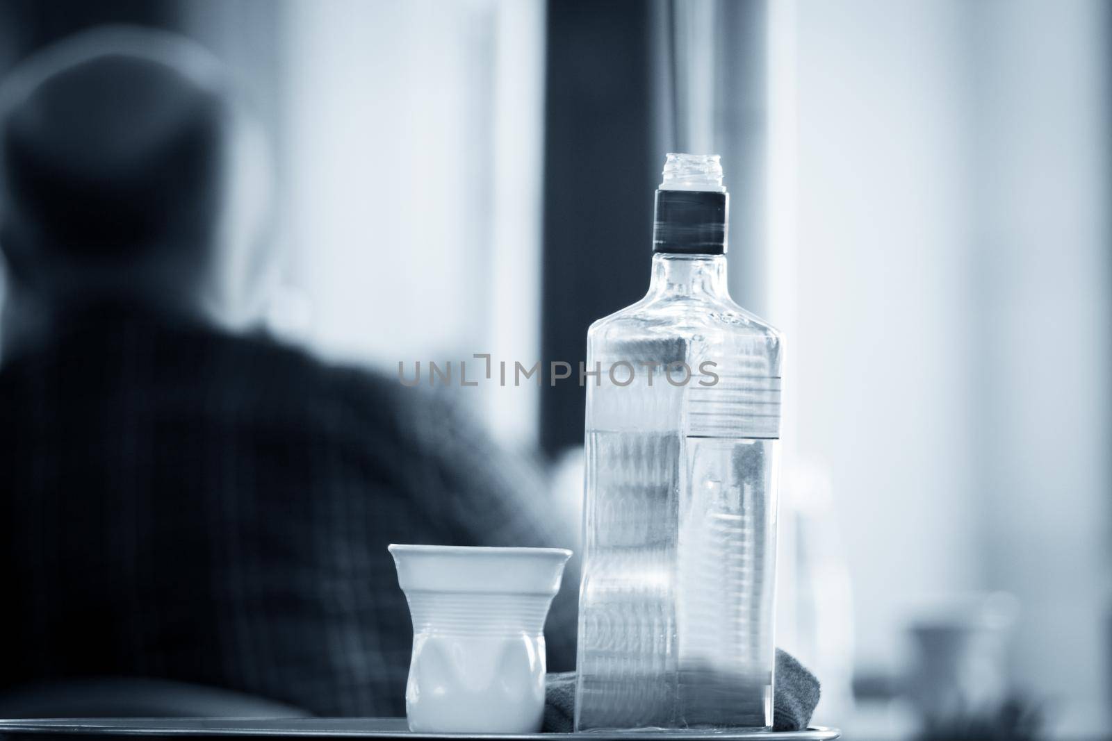 Empty alcohol bottle to be recycled. Transparent