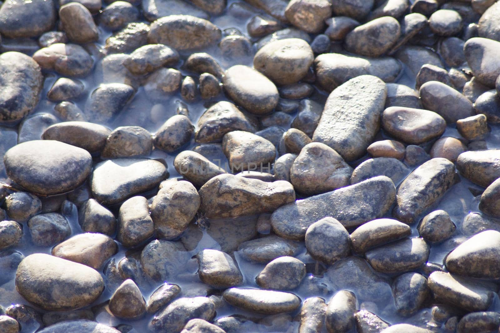 Set of natural stones on the bank of a river. No people
