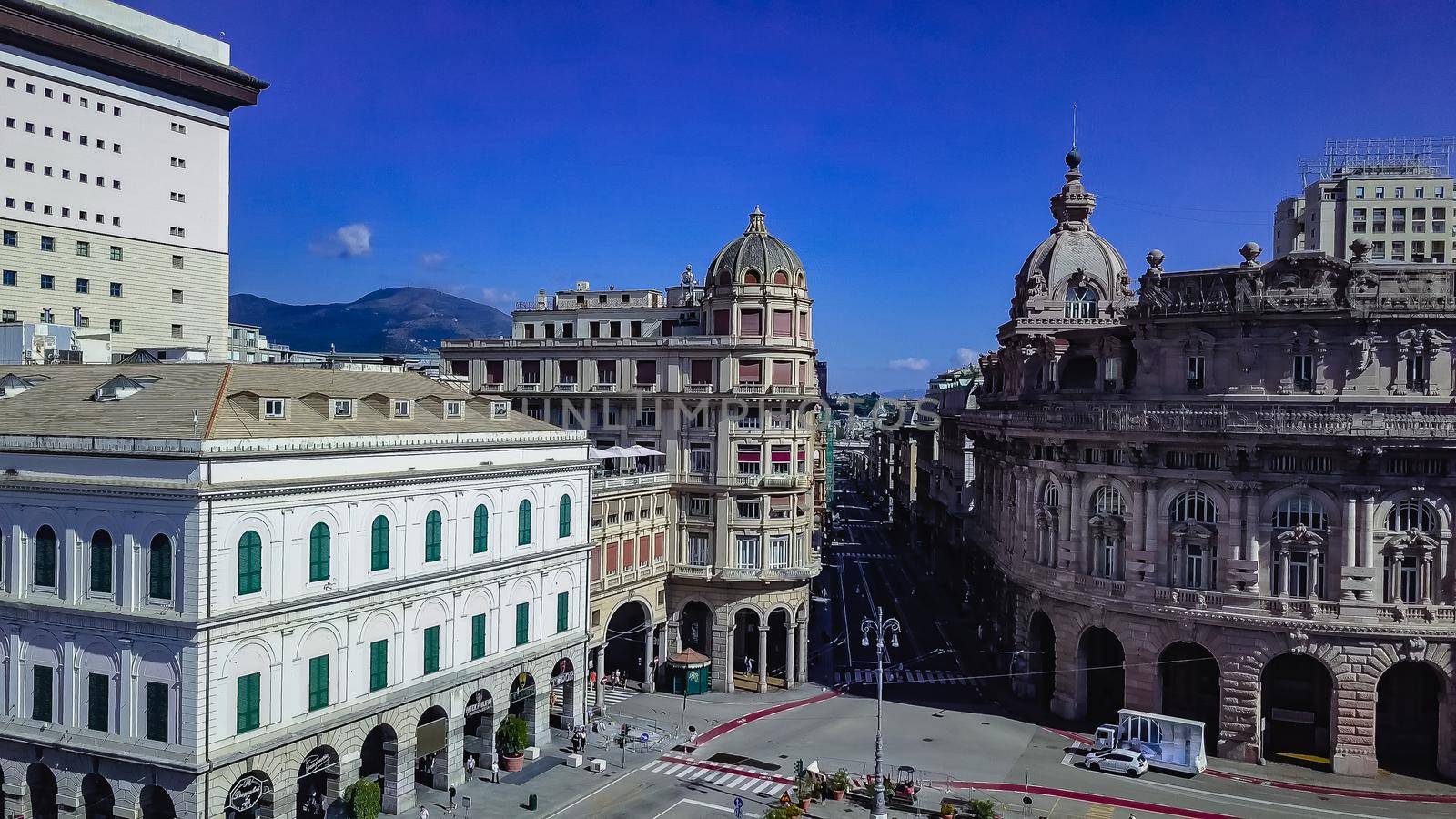 Aerial panoramic drone view of De Ferrari square in Genoa,Italy. Situated in the heart of the city between the historical and the modern center. In the background the Ducal Palace.