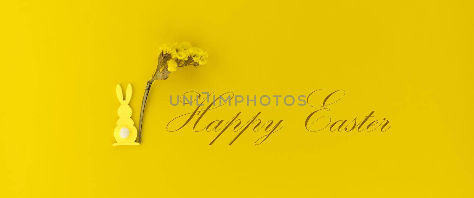 Minimal Easter card or banner with Easter Rabbit figure and flowers on yellow color background with text "Happy Easter"