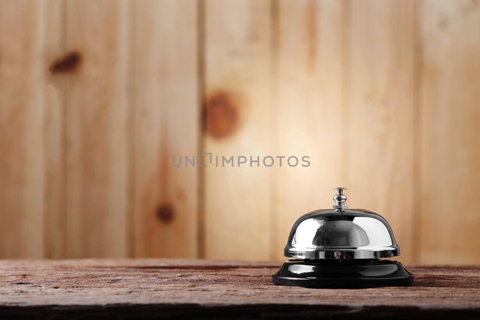 Bell of service on wood background