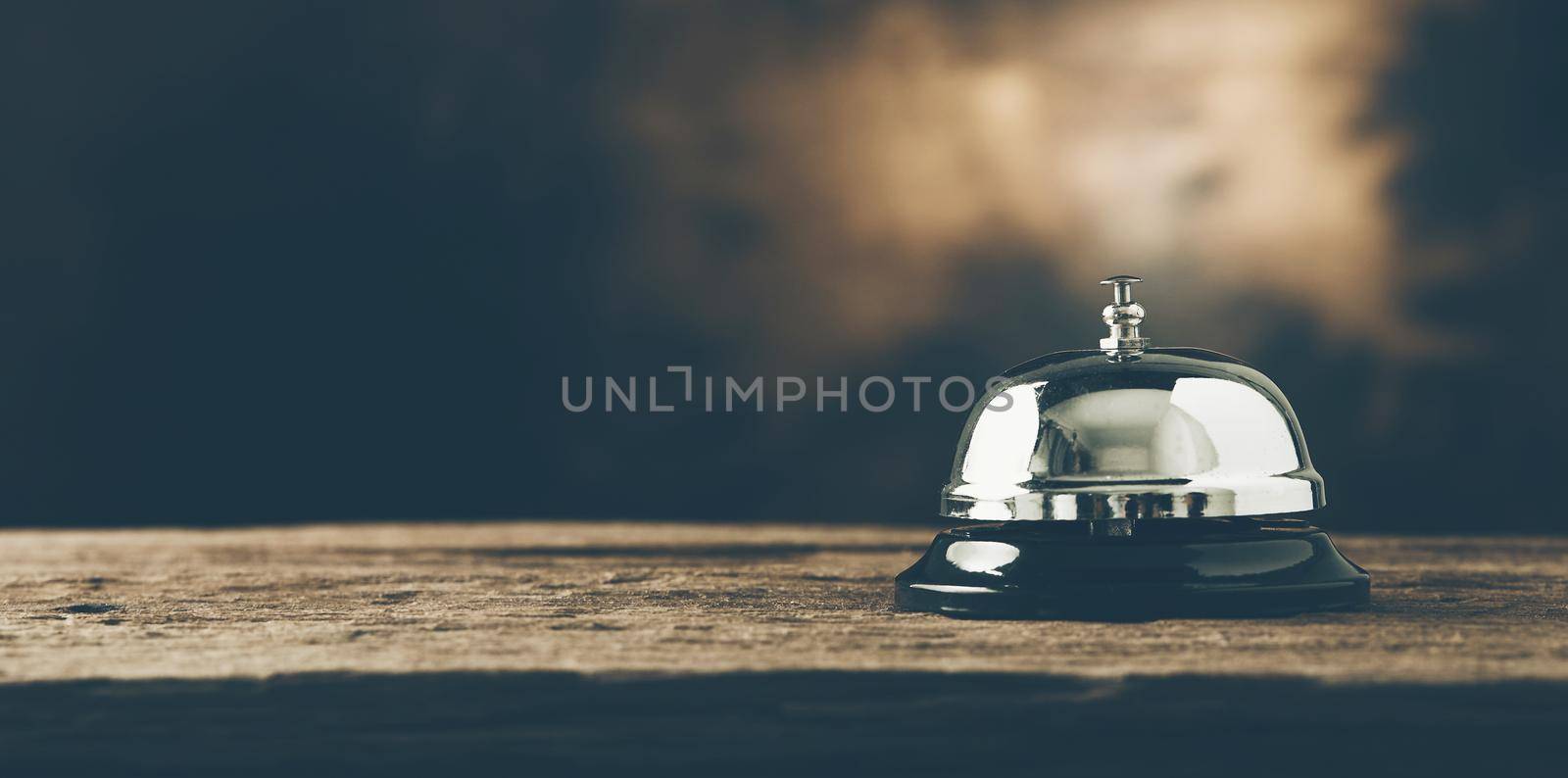 Bell of service on wood by Wasant