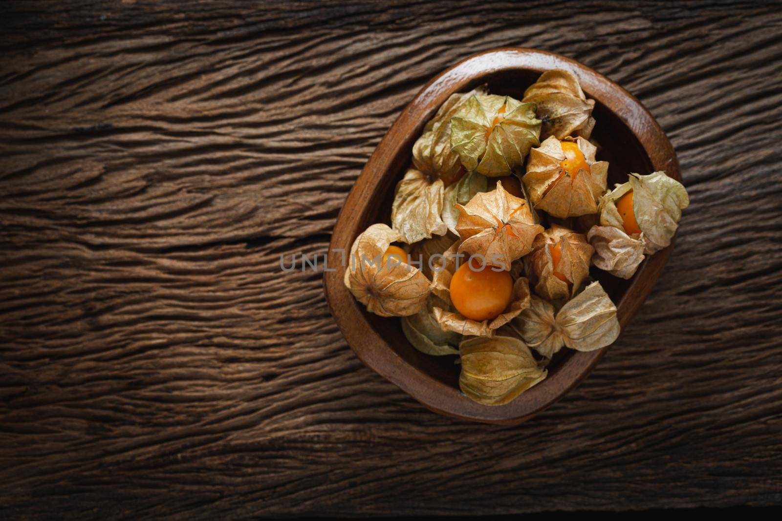 Cape Gooseberries in a group on wood