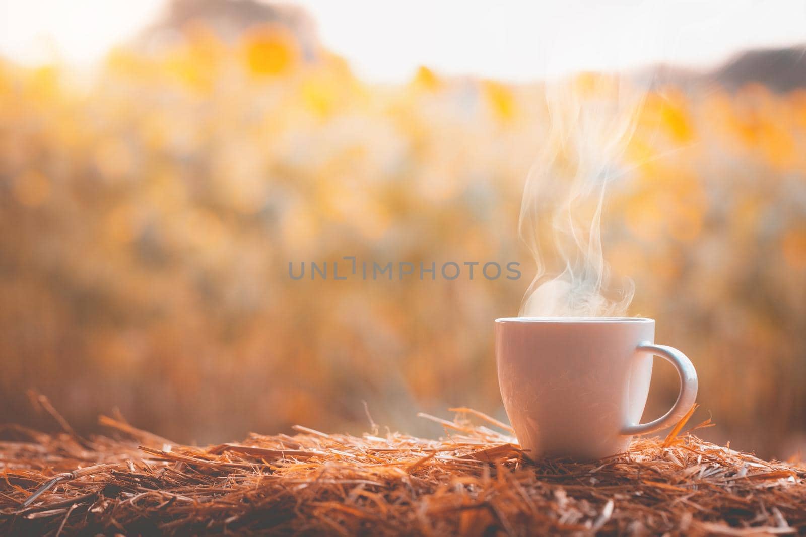 Coffee cup with blurred flower background