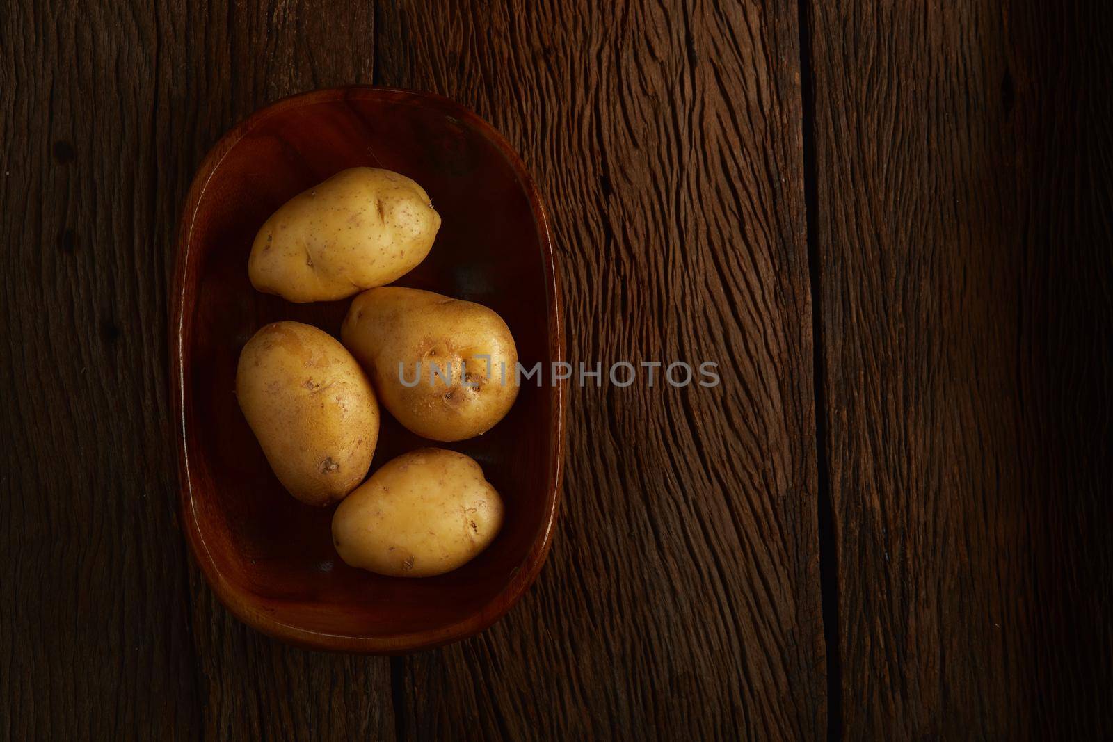 Still life with potato on wood