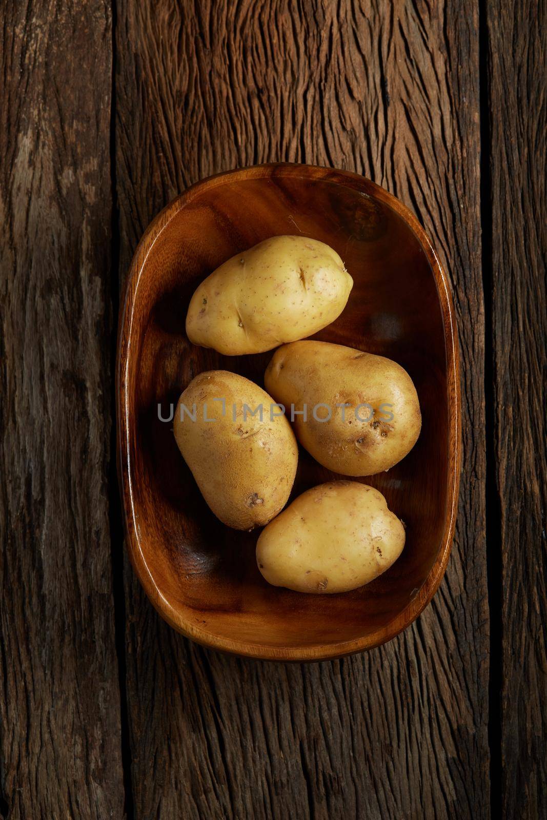 Still life with potato on wood