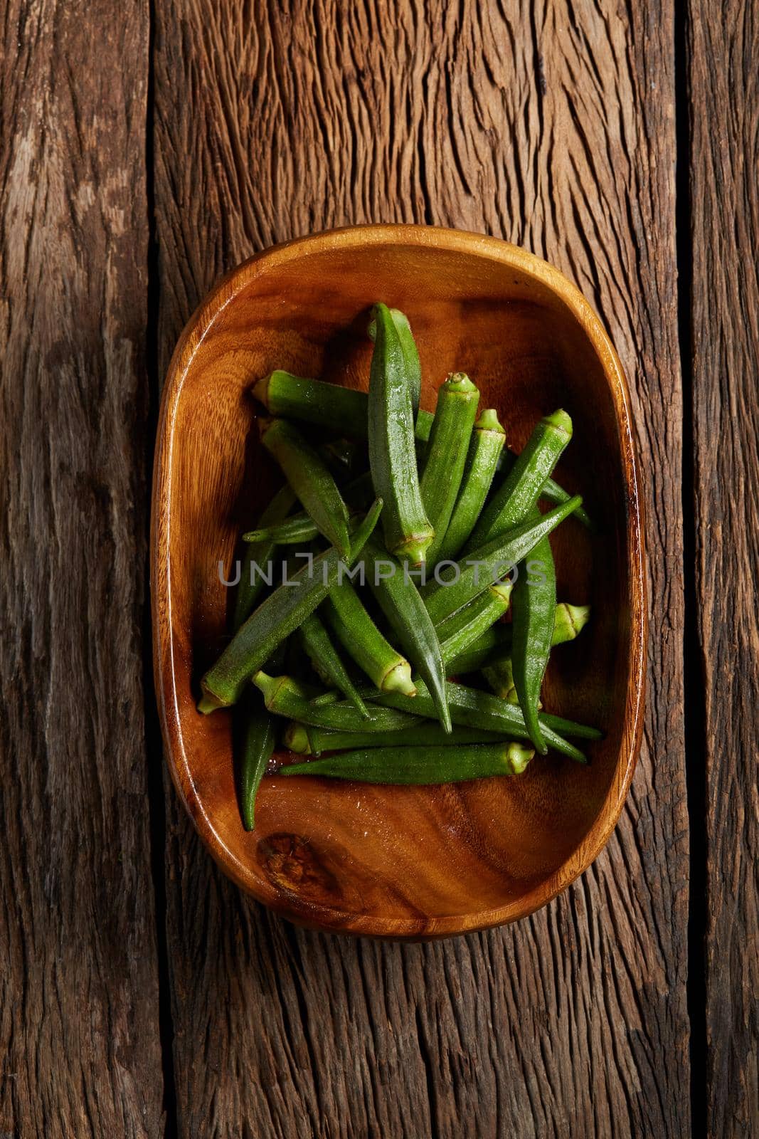 Still life with green roselle on wooden