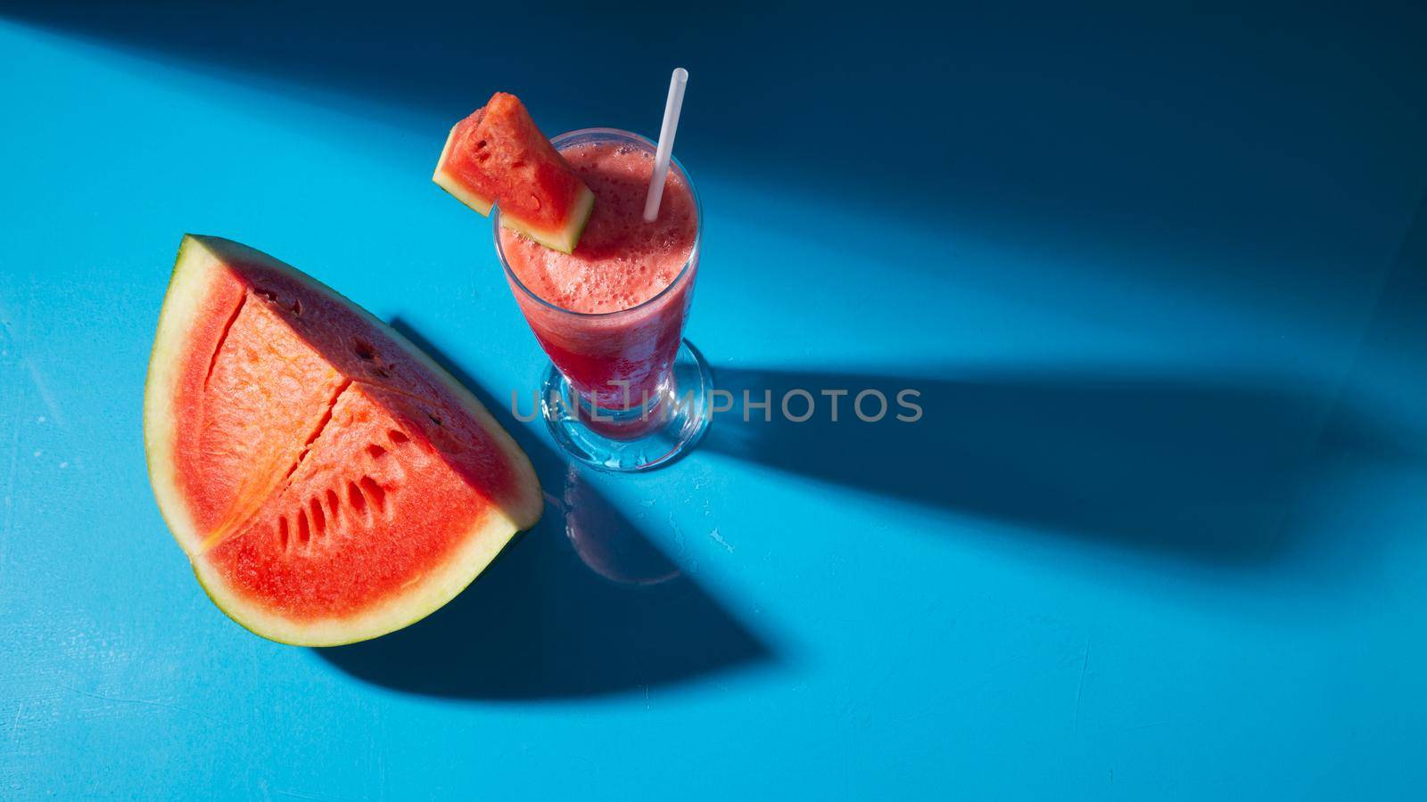 Watermelon juice in glass with slice