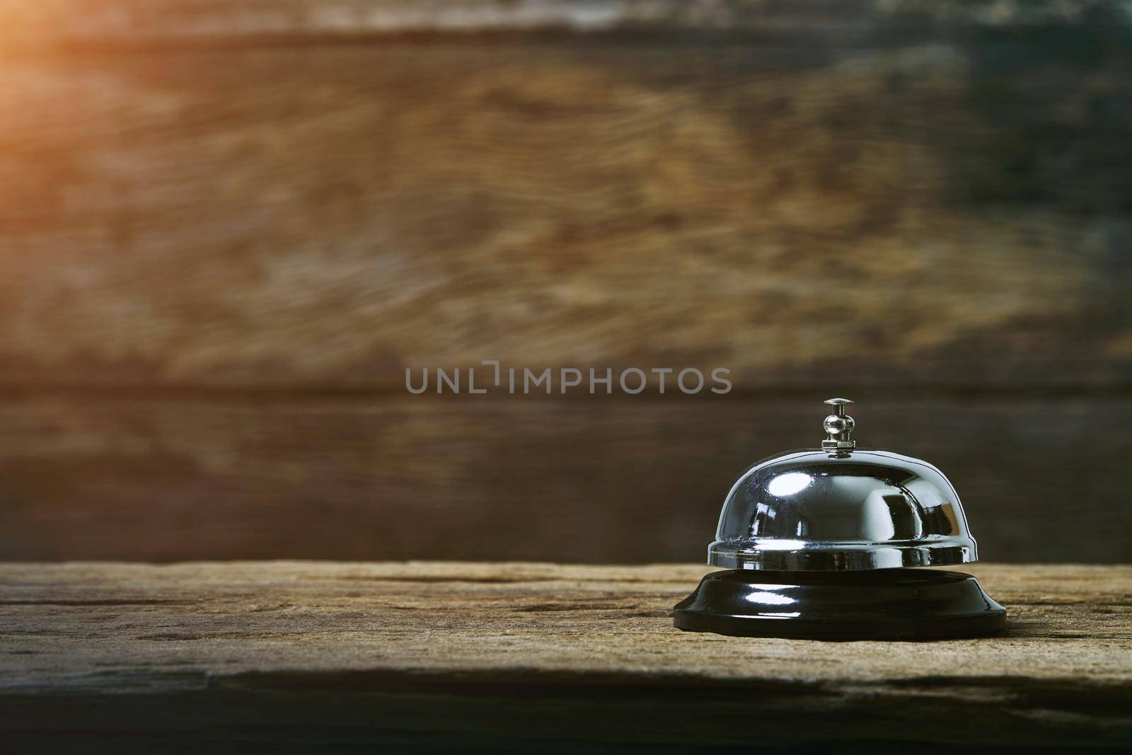 Bell on wood for service with wooden background