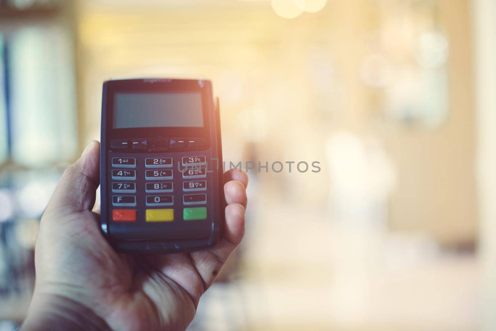 Credit card machine for pay on blurred background