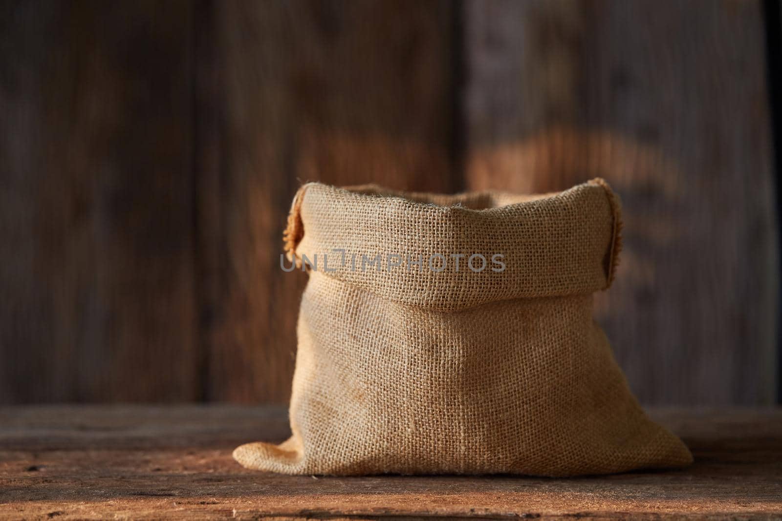 empty Sack Bag on wood background