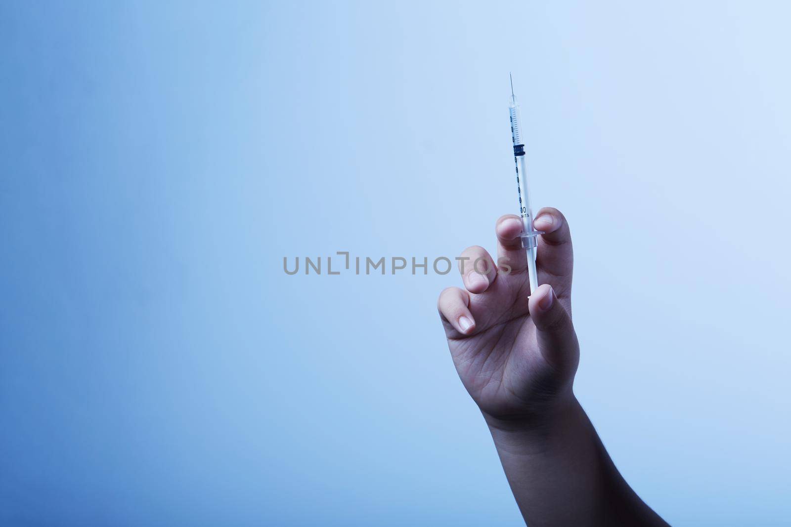 Syringe in the hand by Wasant