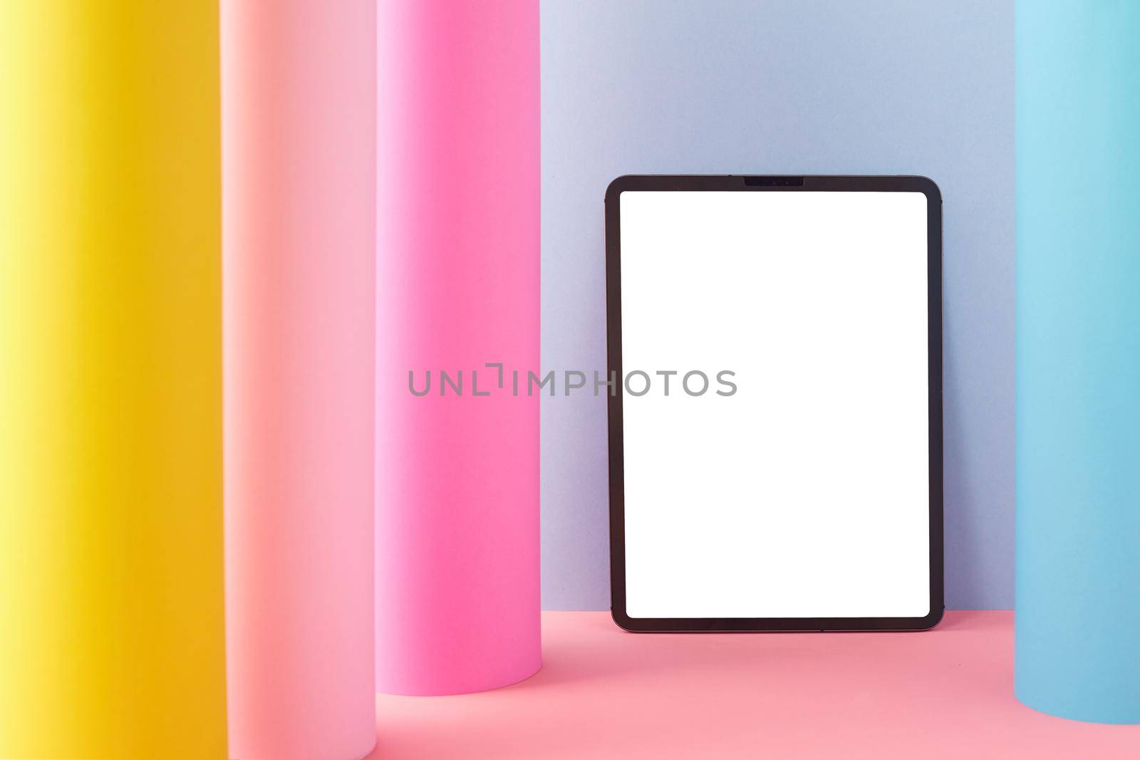Tablet isolated on white with colorful background
