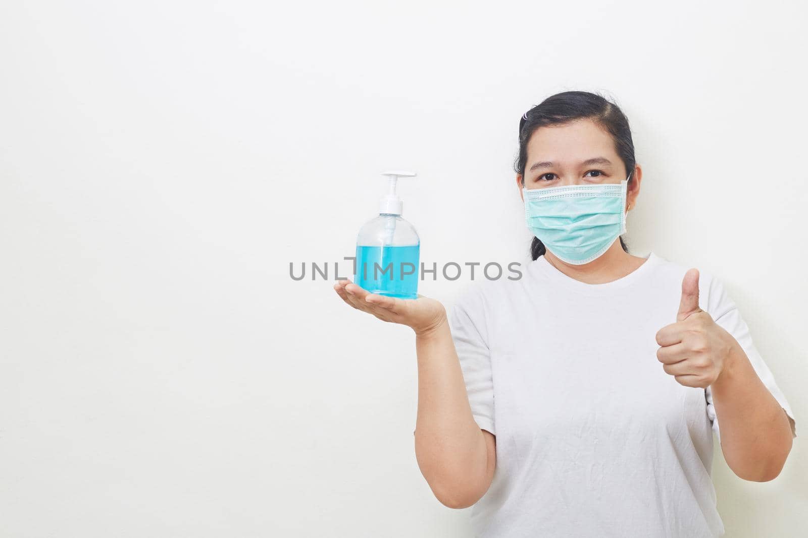 Woman holding bottle alcohol gel. Prevent the virus and bacterias