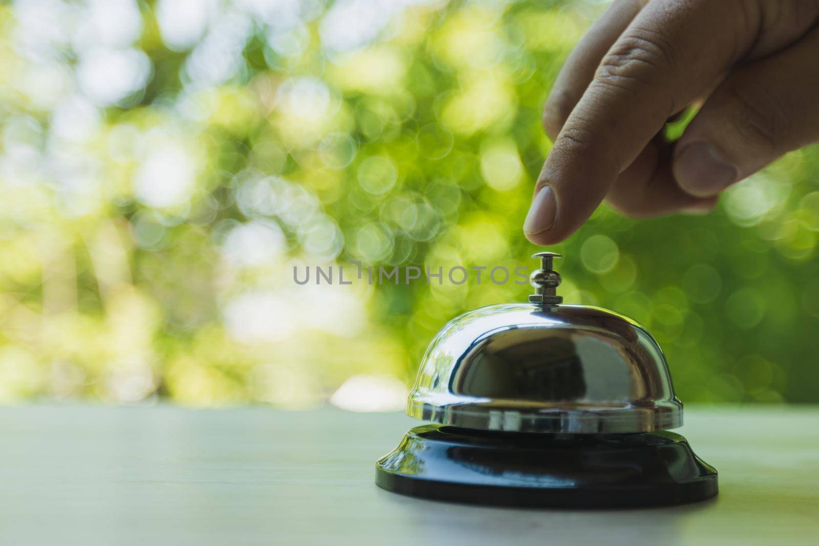 Bell service on counter information, Bell call for service with green bokeh background