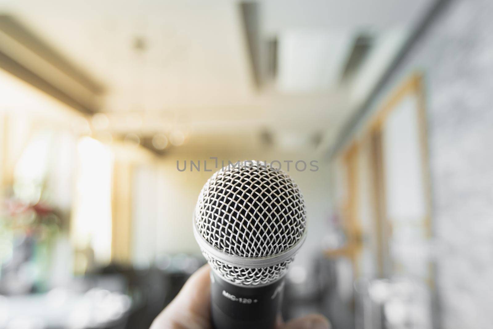 Microphone close up on blurred bokeh background