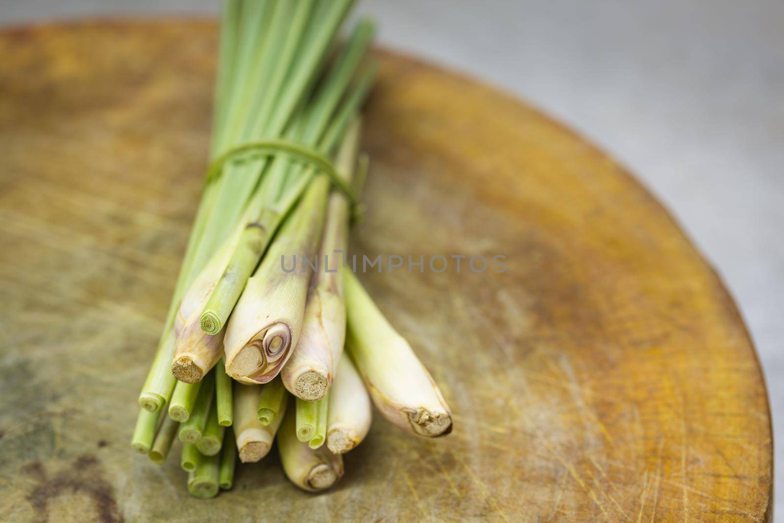 Fresh lemongrass (citronella) on wooden background - Spice for health.