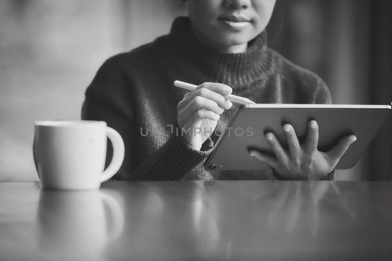 Women working with tablets online, Photo black and white filter