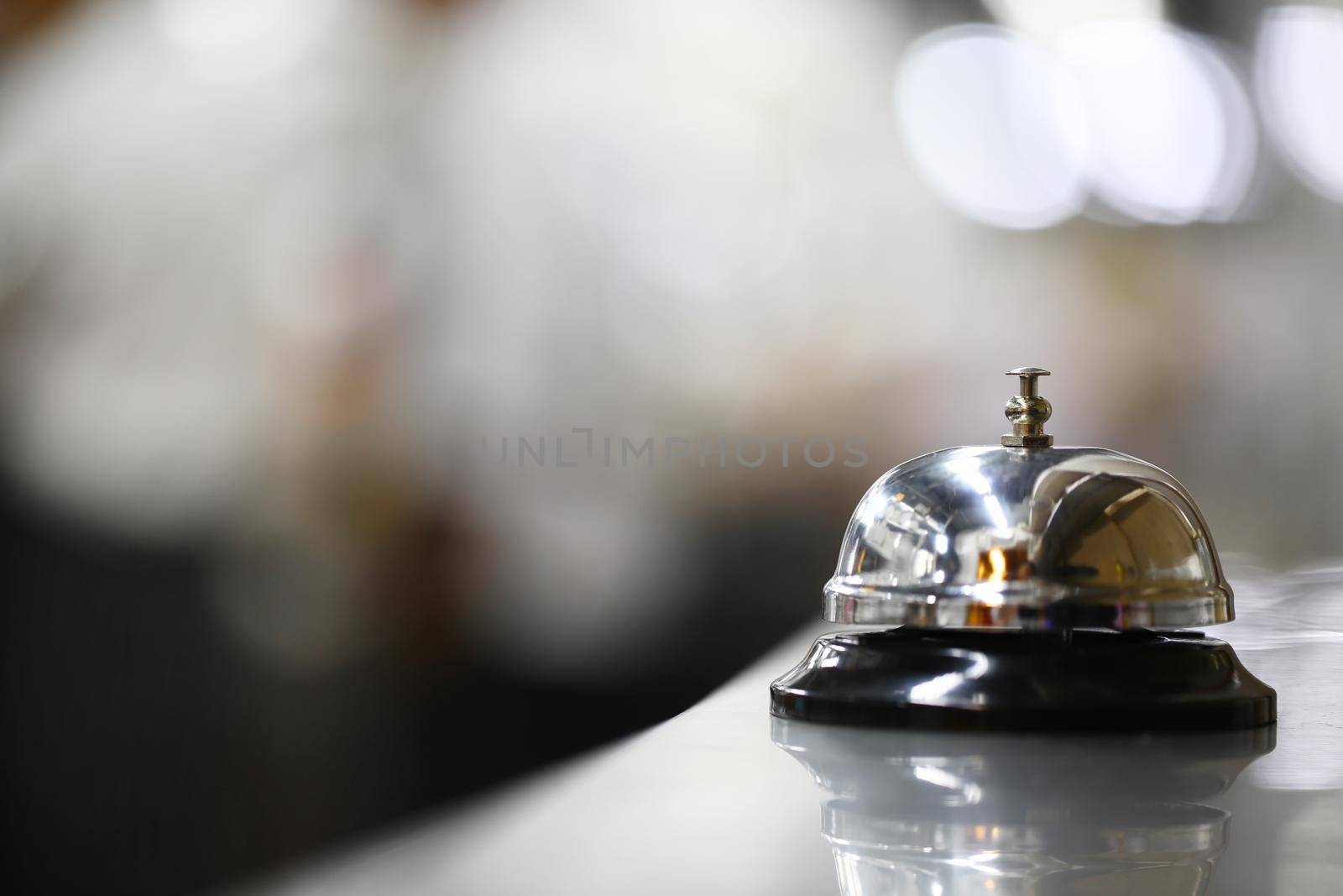 Bell on counter for service with blurred background