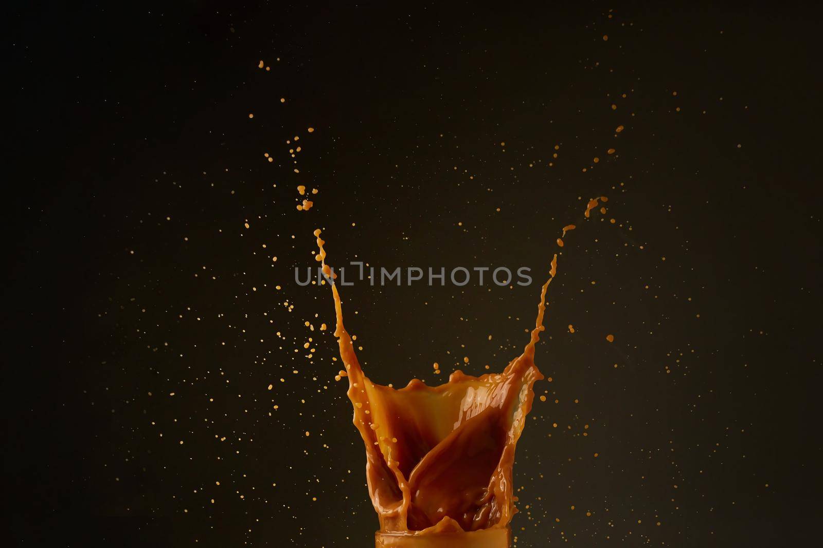 Coffee splash on dark background
