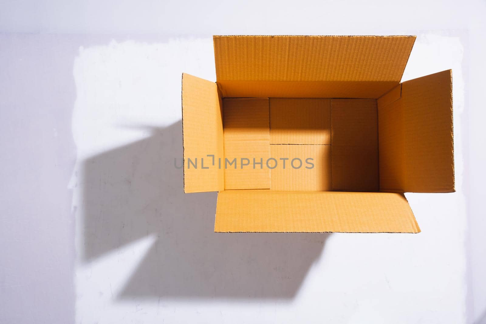 Empty paper box is open on white background