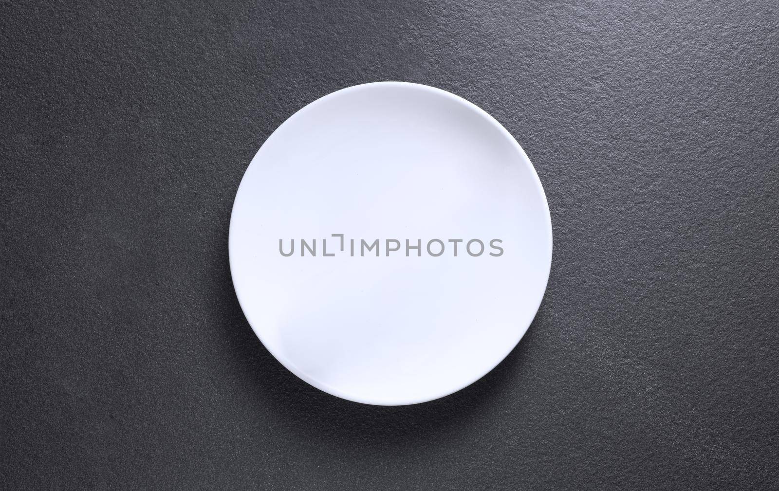 Empty plate on marble background, top view photo