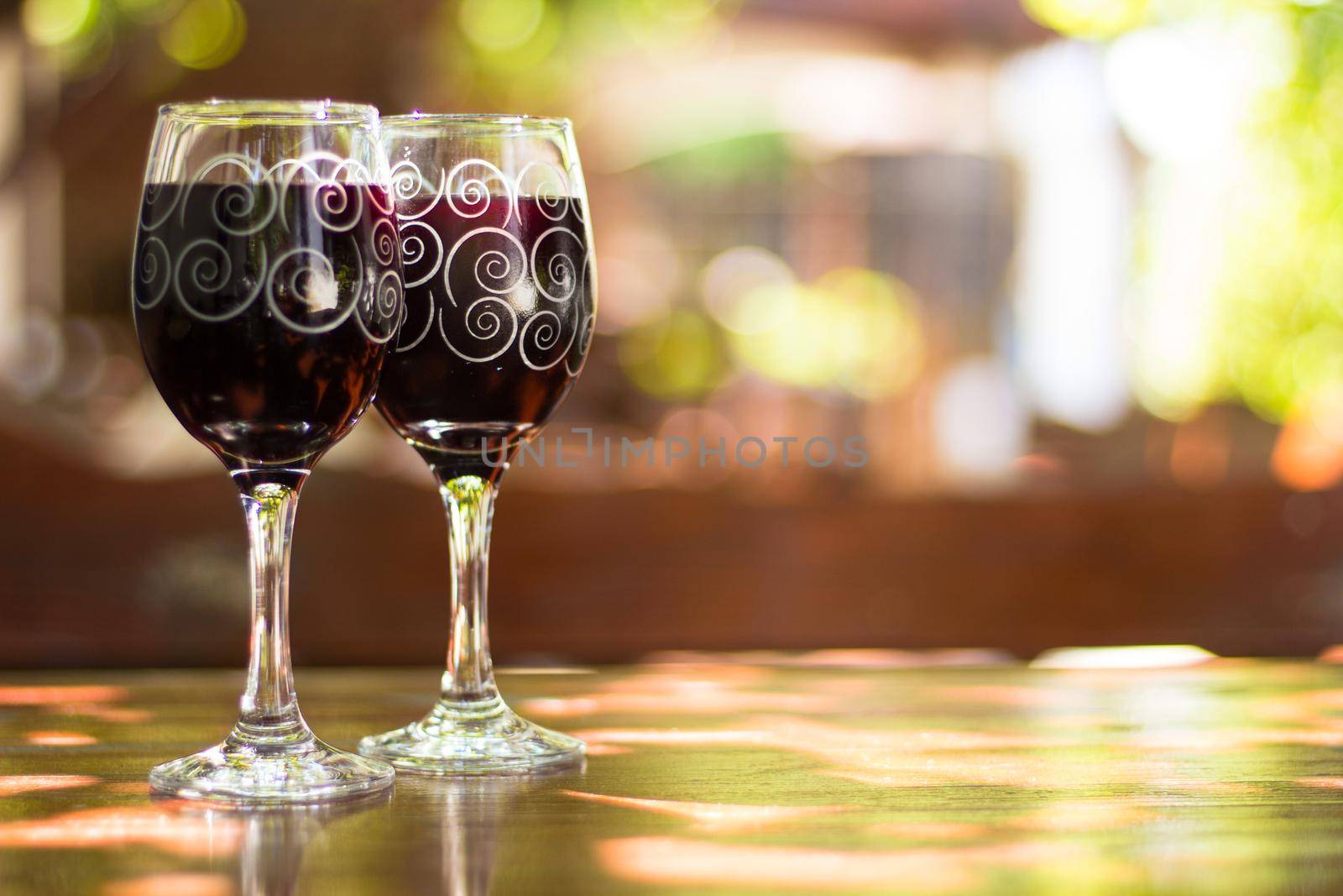 Two glasses of red wine by destillat