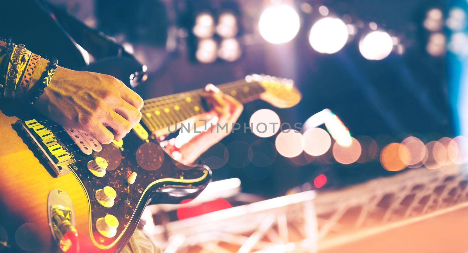 Stage lights.Abstract musical background.Playing guitar and concert concept by carloscastilla