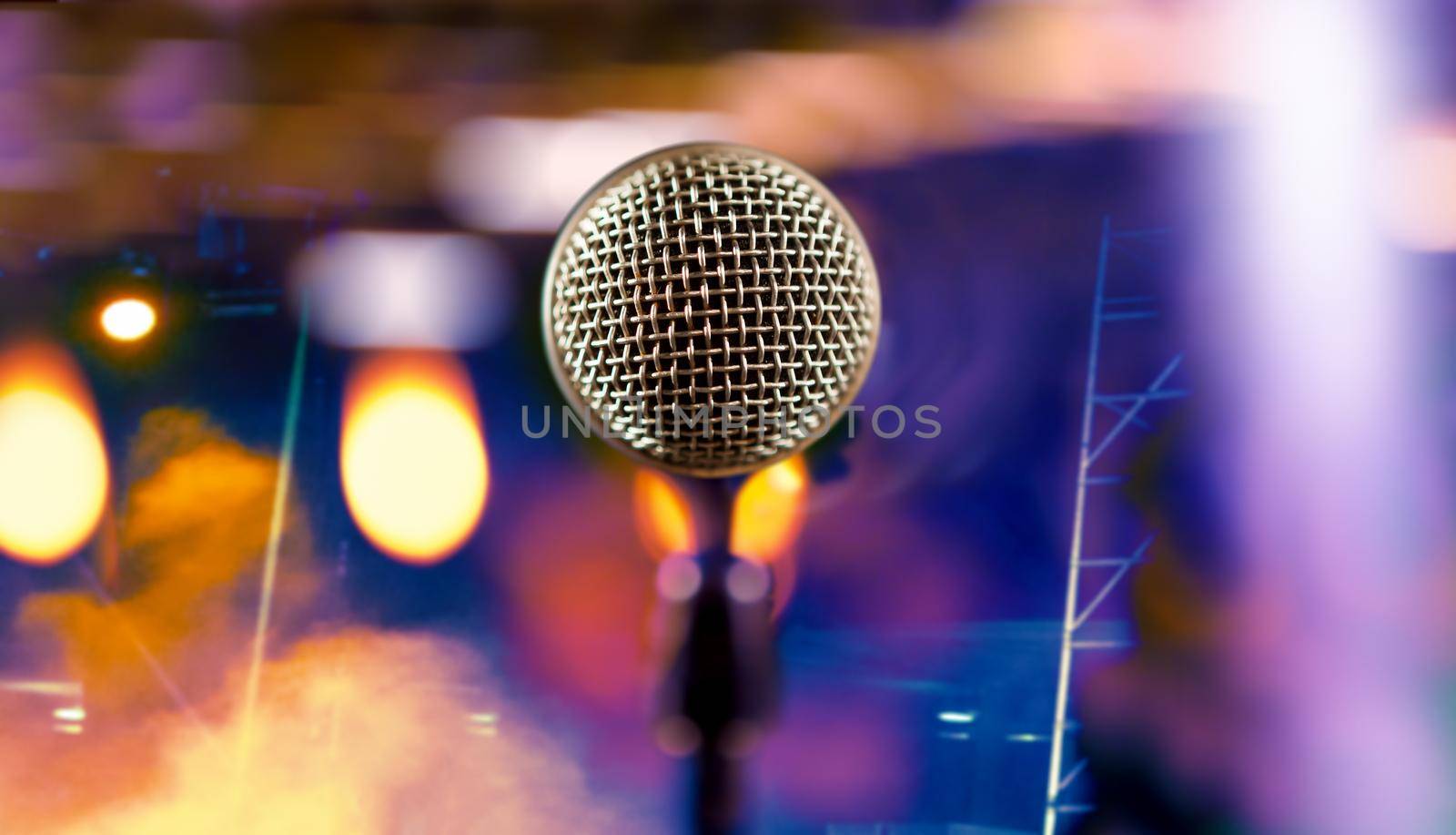 Live music background.Microphone and stage lights