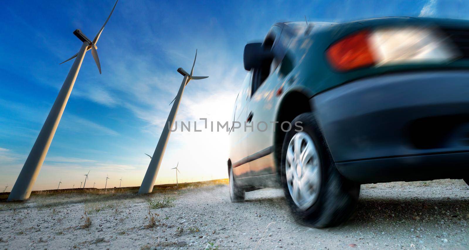 Wind mills and tire car detail.Electricity and ecology