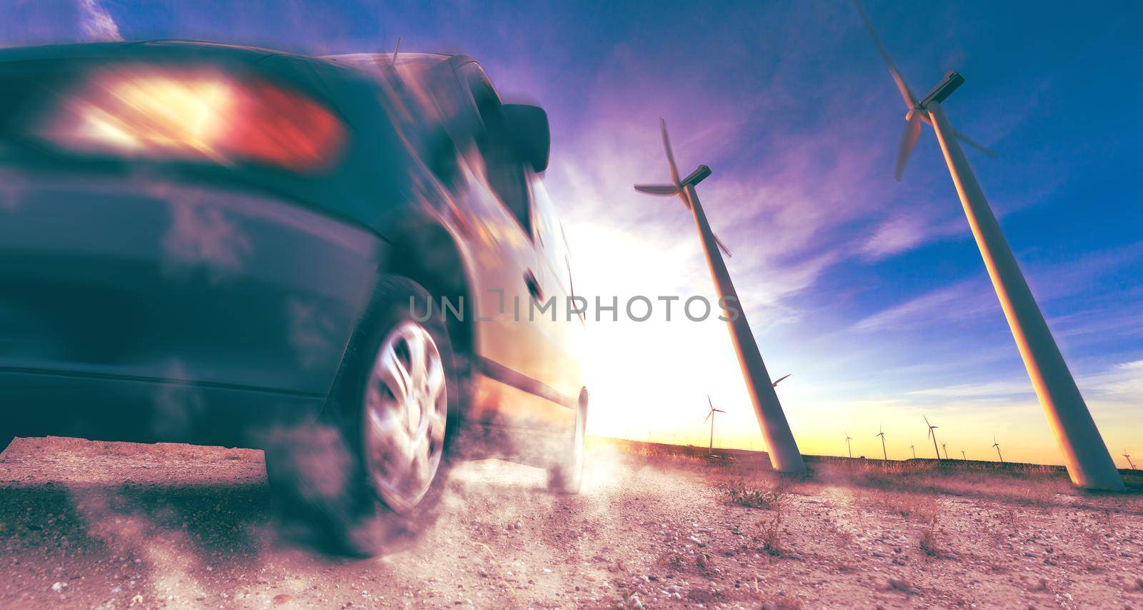 Wind mills and tire car detail.Electricity and ecology