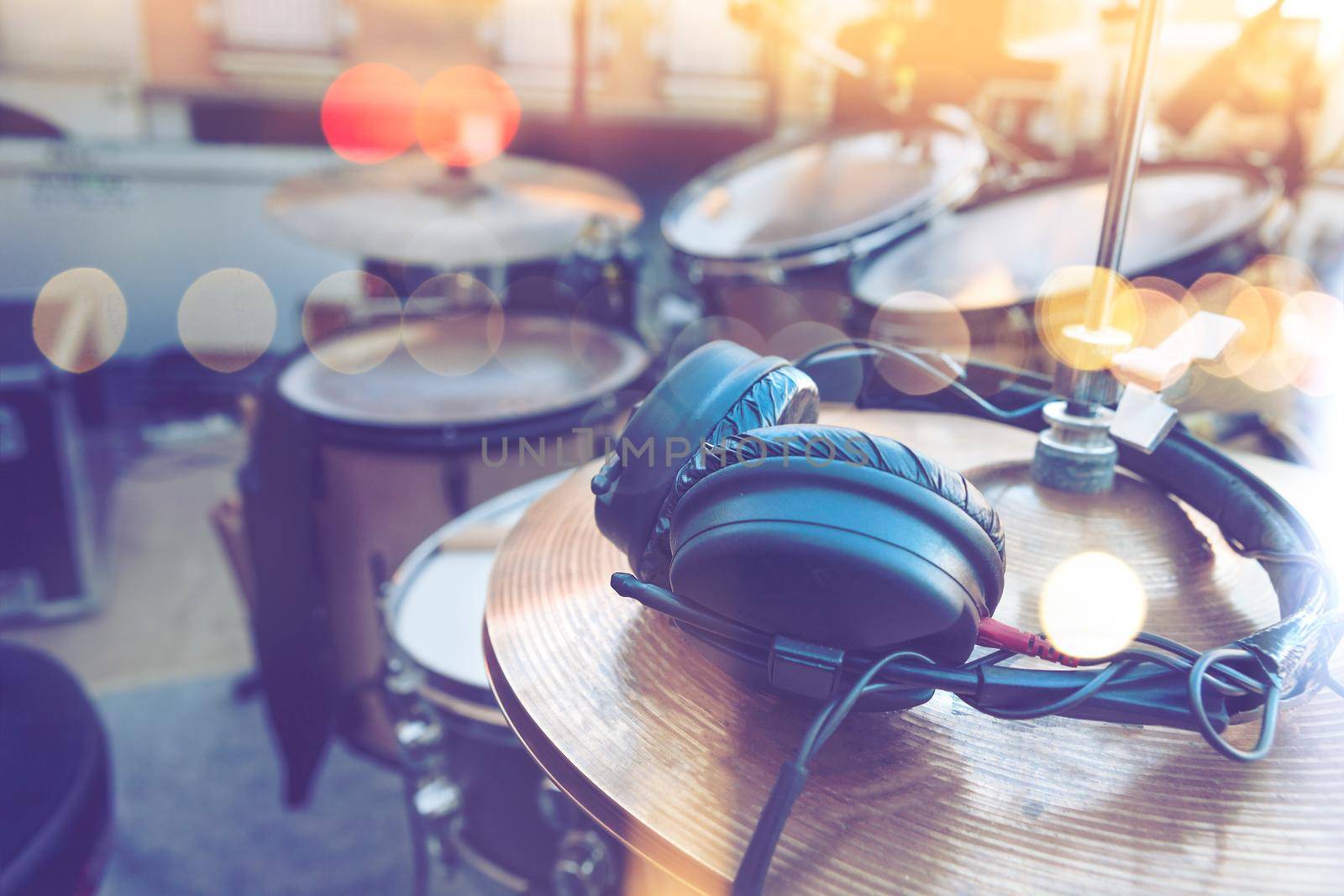 Drum and headphones on stage.Musical instrument