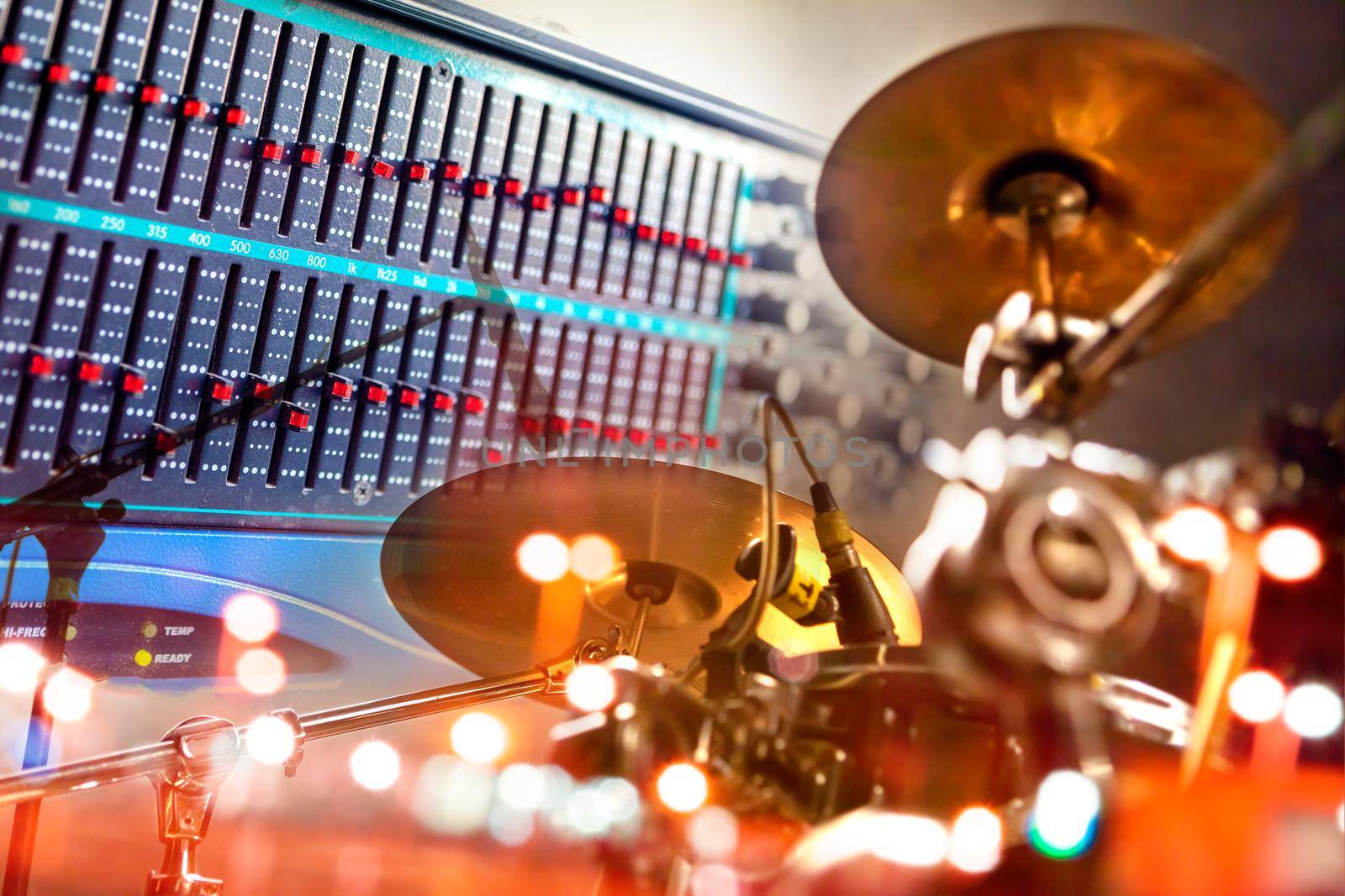 Close-up of drum player and mixer.Sound engineering and music production