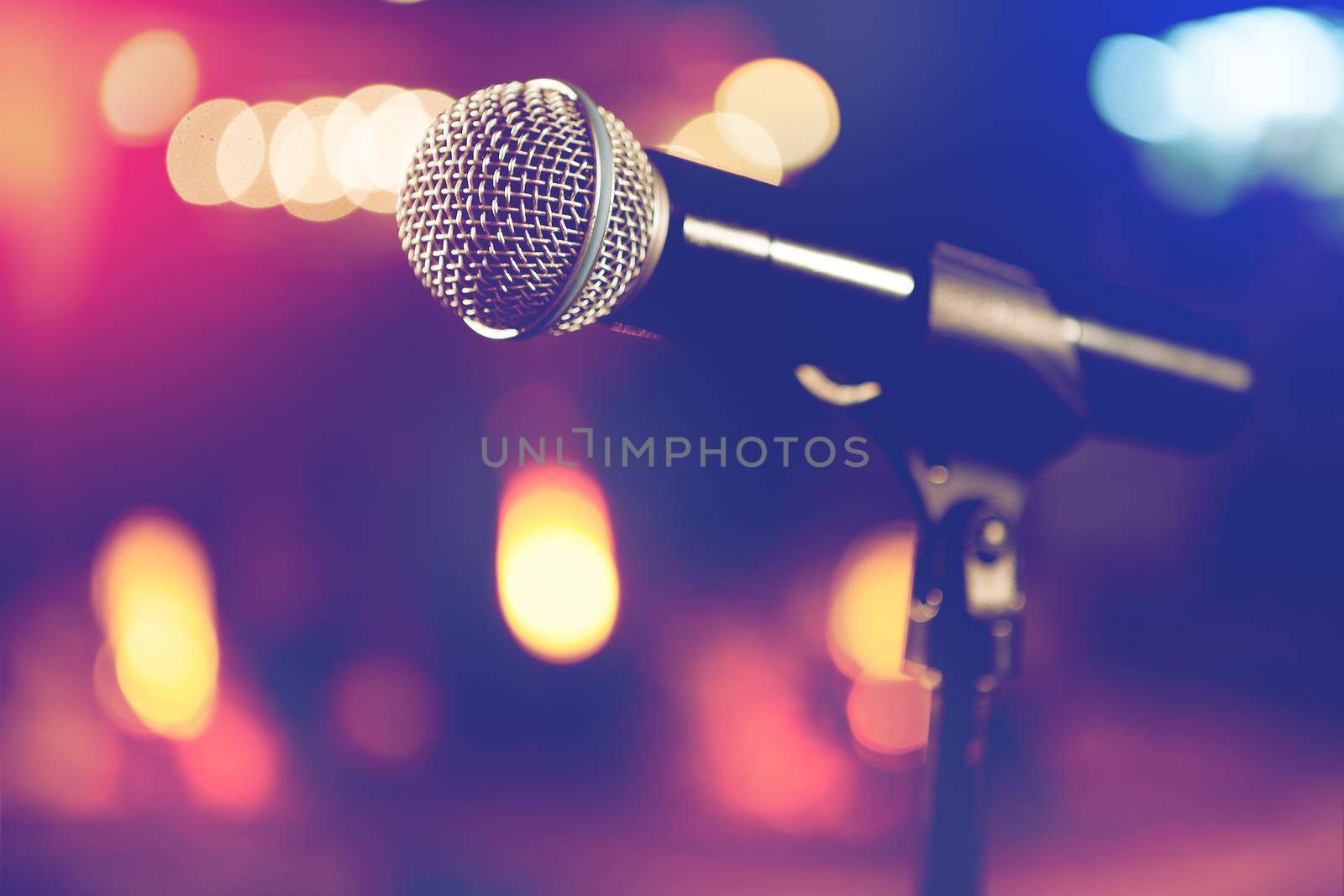 Live music background.Microphone and stage lights